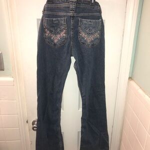 L.E.I blue jean low rise flares. With embroidered back pockets. Size 7.